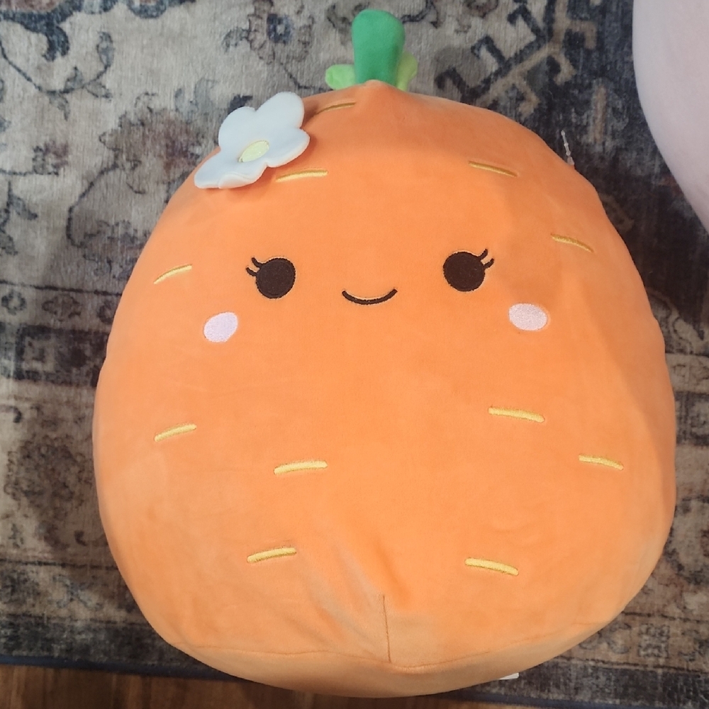 Orange Plush Pillow with Flower Accent